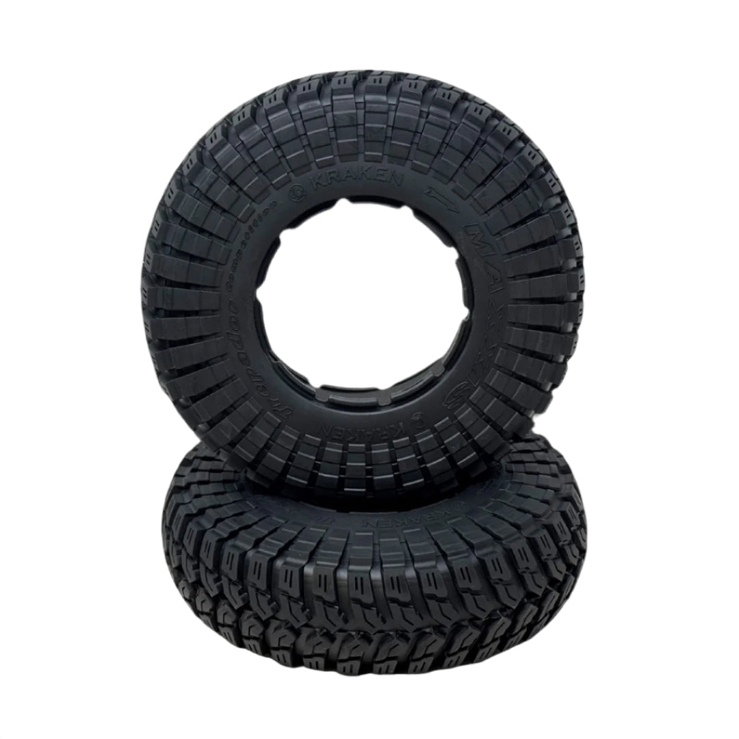 Two black off-road tires with tread pattern on a transparent background