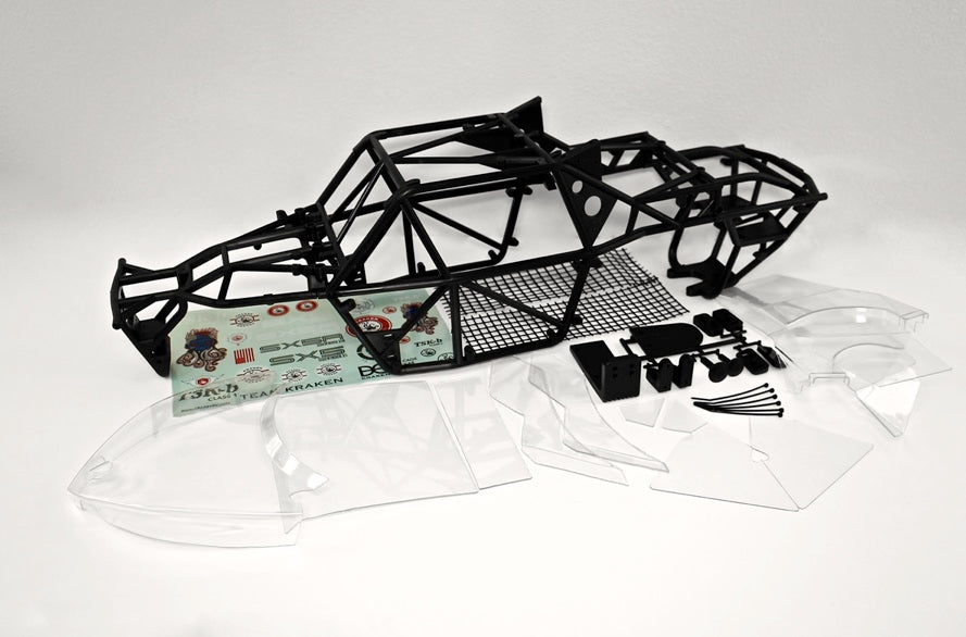 A photograph of the Kraken RC TSK-b Class 1 Kit which includes modular roll cages, heavy duty body kit made of Lexan panels, and other installation accessories for HPI Baja 5b remote control buggy.