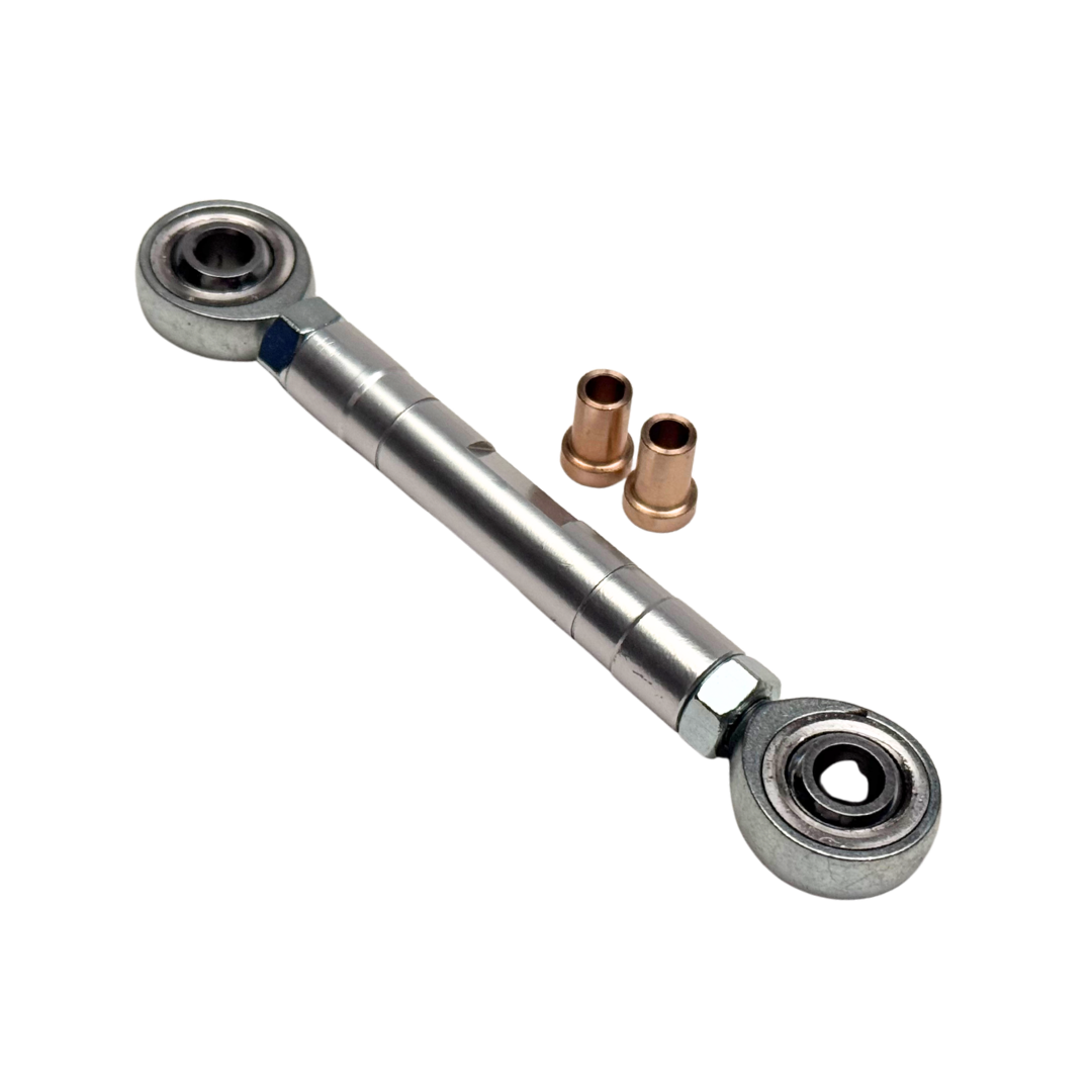 Metal rod with bearings and small copper components on a white background