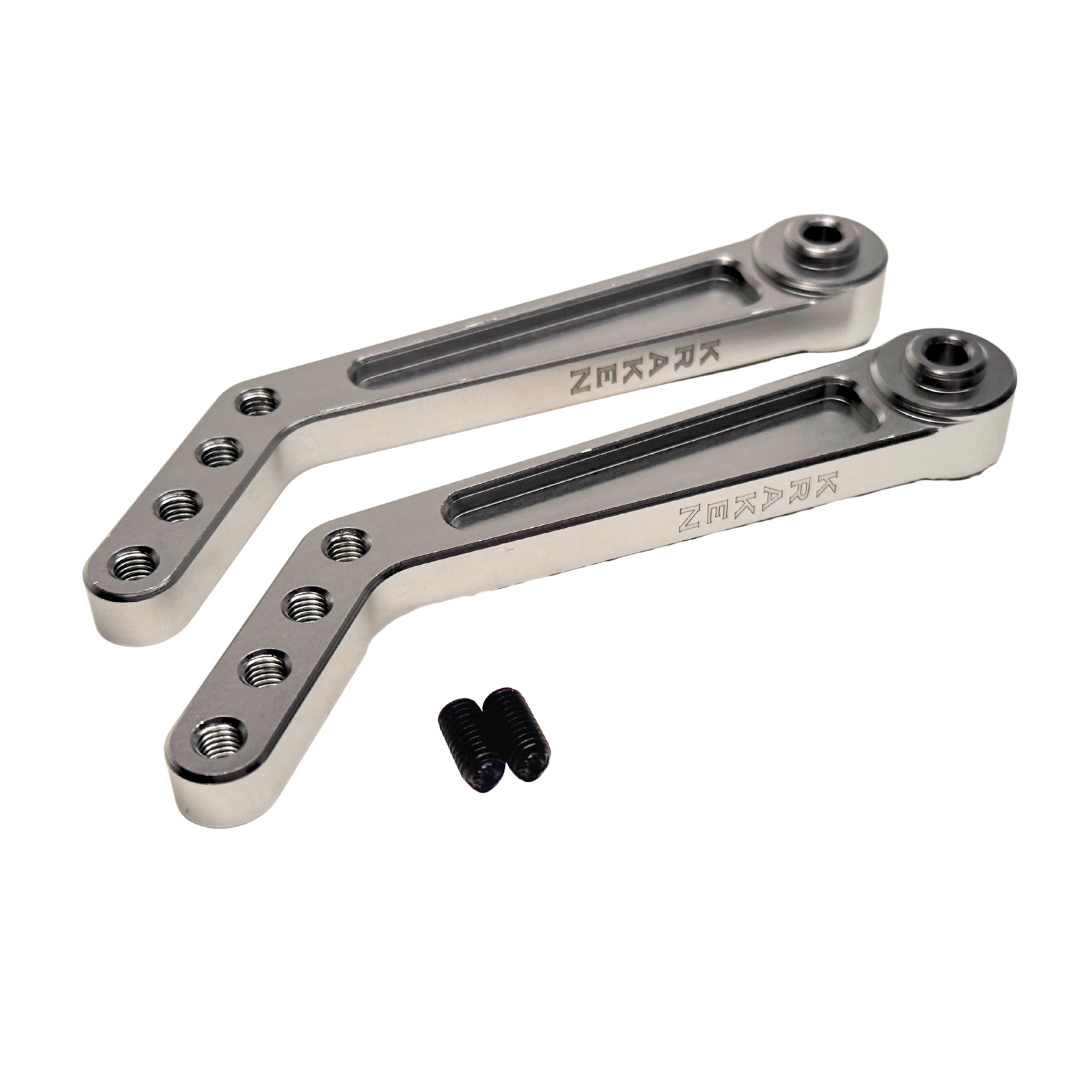 Two metal brackets with screws on a white background