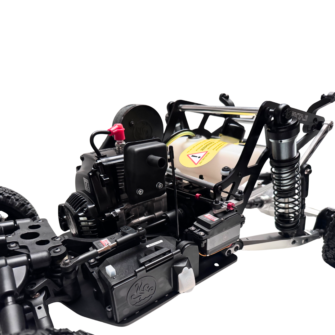 Close-up of a black off-road vehicle chassis with visible components on a white background