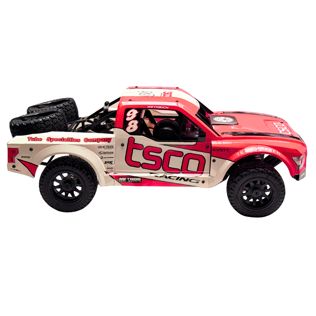 Red and white off-road model truck with 'tsco' branding on a white background