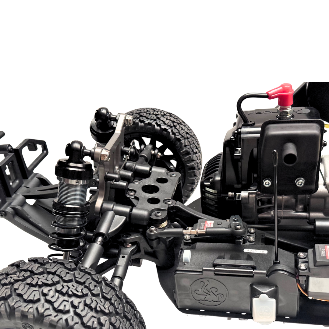 Close-up of a detailed model car chassis with visible components on a white background