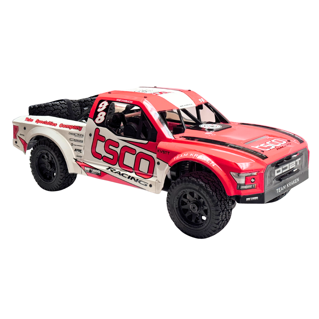 Red and white off-road model truck with 'tsco' branding on a white background