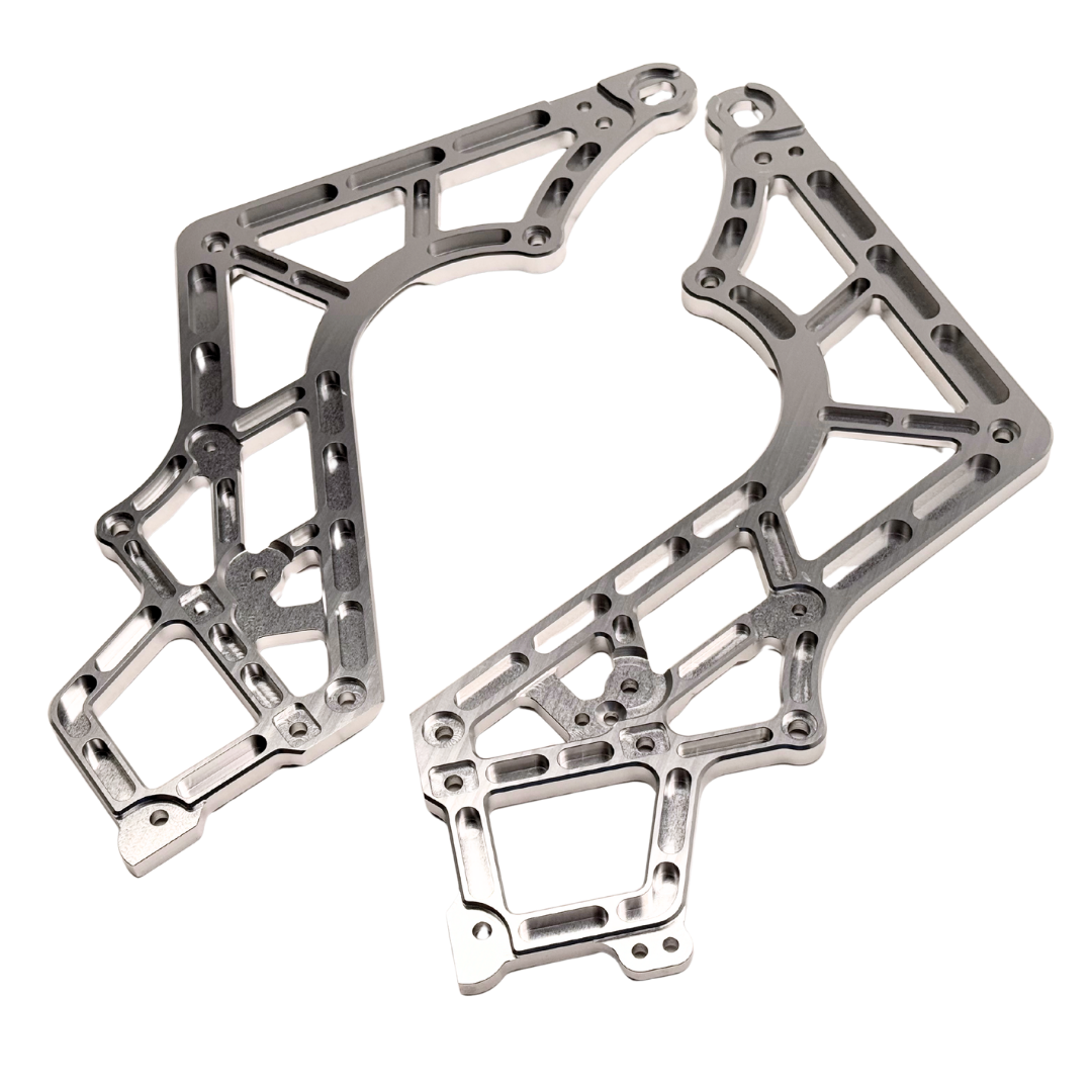Two metallic chassis frames on a white background