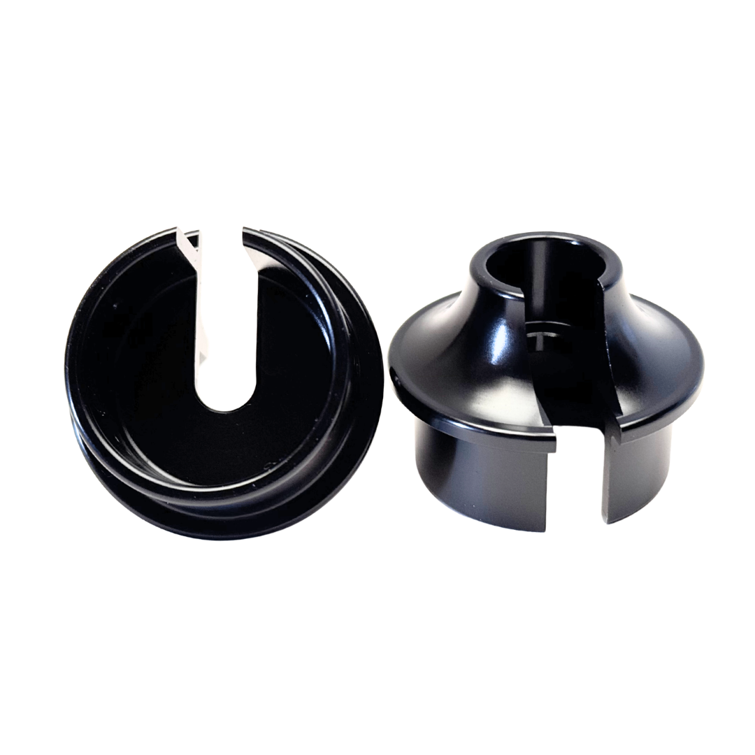Two black plastic components on a white background