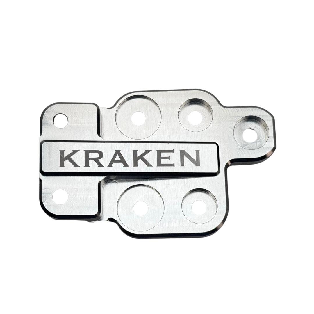Metal component with 'Kraken' branding on a white background