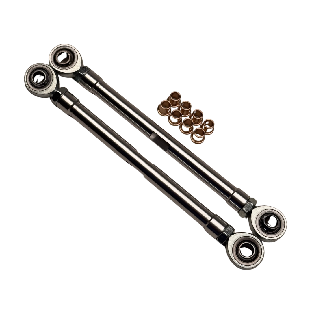 Two metal linkage rods with spherical bearings and small metal components on a white background