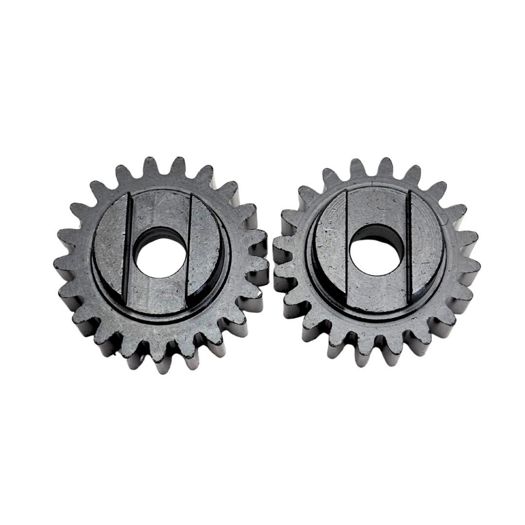 Two metal gears on a white background